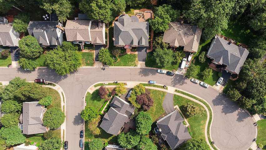 An image of an aerial view of homes in a residential neighborhood.